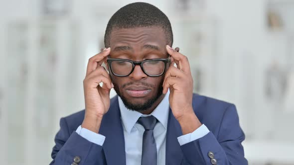 Portrait of Tired African Businessman Having Headache 