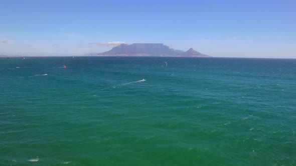 Travel drone Table Mountain, Table Bay, kiteboarders, Bloubergstrand, Cape Town, South Africa.