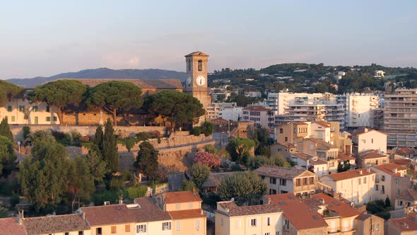 Clock Tower and City of Cannes at Sunrise