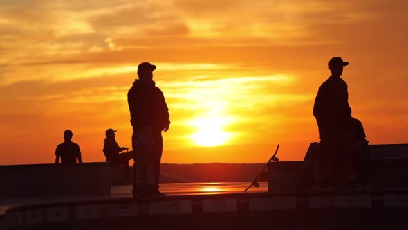 Men in Front of Sunset in the Background