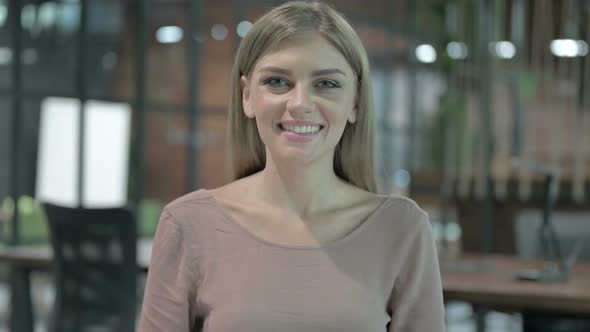 Portrait Shoot of Cheerful Woman Smiling at Camera