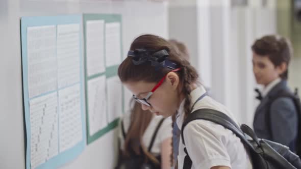 Serious Schoolgirl Hurrying up to Lessons alt