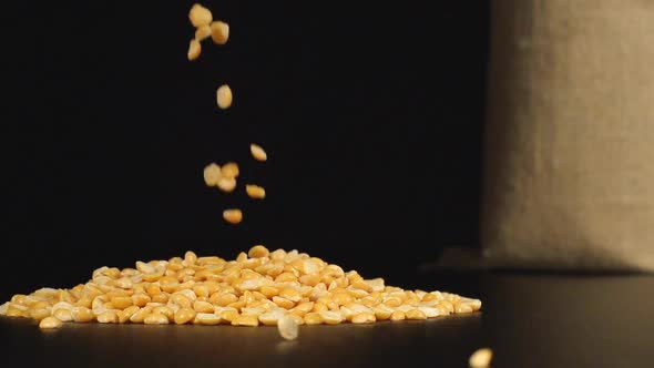 Yellow Peas Fall In A Pile On A Table