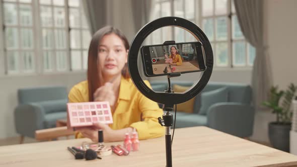 Display Of Smartphone Recording Video Blog For Asia Beauty Blogger Woman With Make-Up At Home Studio