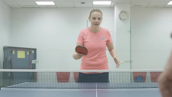 Portrait of Positive Blond Sportswoman Winning in Ping-pong Game. Cheerful Smiling Young Caucasian