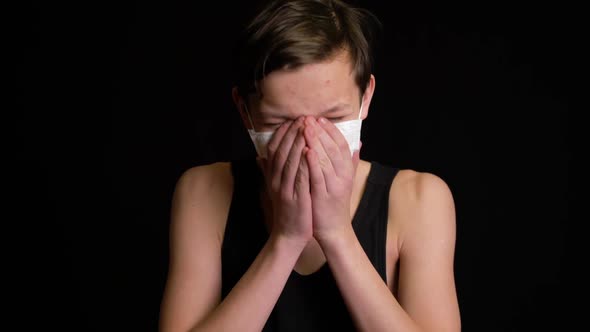 Boy Coughs Into Mask