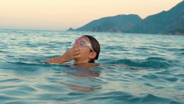 Girl in Mask Diving. Baby Girl Swimming and Diving During Summer Holidays