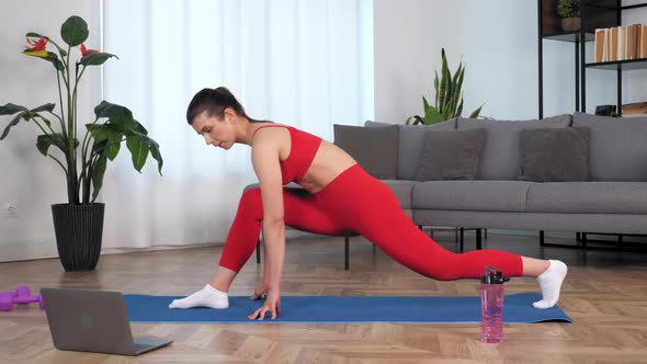 Fit Woman Watch Online Sport Webinar Laptop Doing Warmup Stretching Training