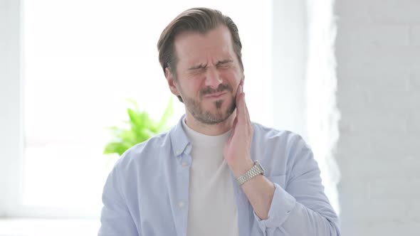 Portrait of Sick Young Man Having Toothache