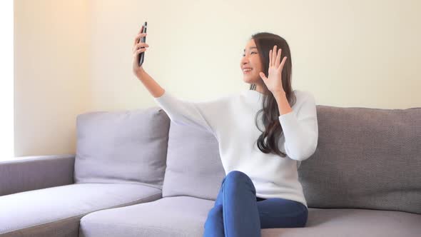 Young asian woman use smart phone