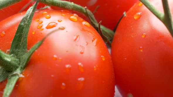 Tasty looking red organic tomato food background 4K 2160p 30fps tilt UHD footage - Vegetables on vin