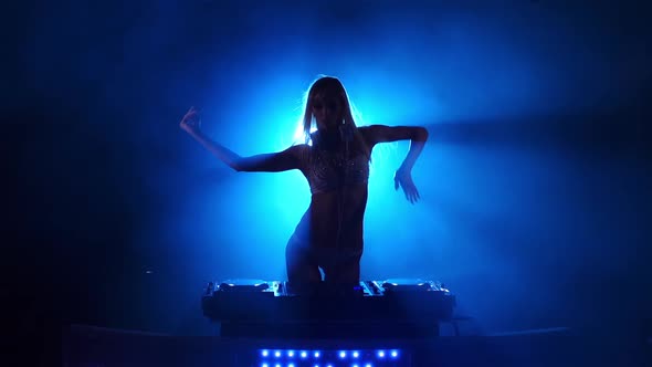 DJ Girl Dancing Behind the Decks. Slow Motion