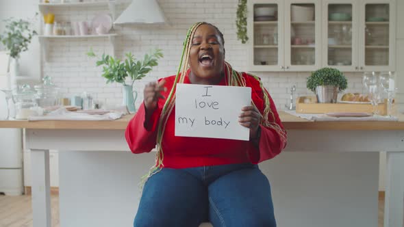 Obese Black Female Holding Body Positive Placard