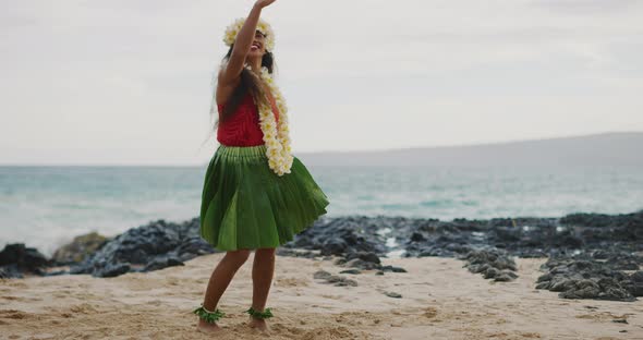 Woman performing Hawaiian hula on the beach