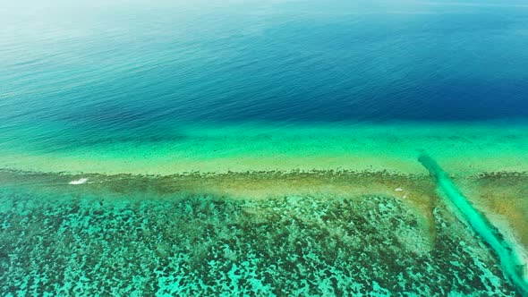 Aerial flying over travel of relaxing seashore beach voyage by blue green sea and white sandy backgr