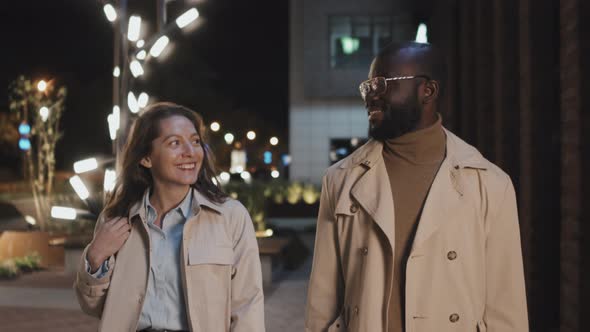 Man and Woman Walking Outdoors