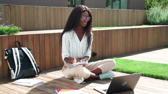Young Happy Black Woman Student Learning Virtual Online Seminar Class Outdoor