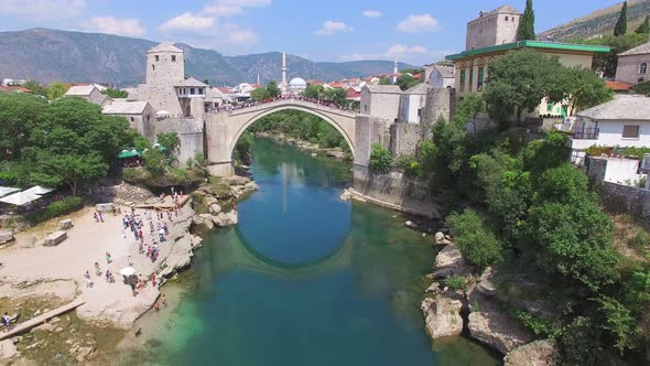 Crowd watching people jumping of the bridge in Mostar