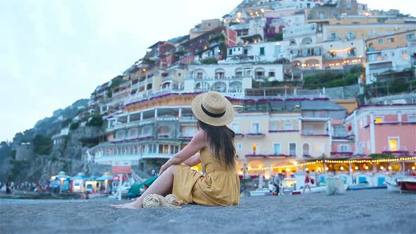 Summer Holiday in Italy. Young Woman in Positano Village on the Background, Amalfi Coast, Italy