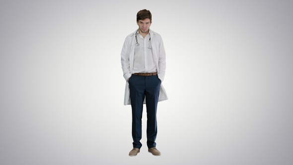 Sad young man doctor shaking had on gradient background.