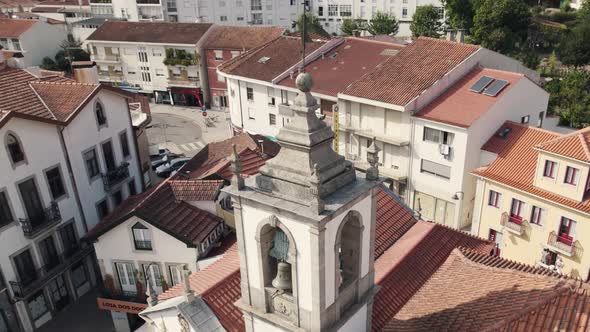 Historical bell tower of Arouca town in Portugal, aerial orbit view
