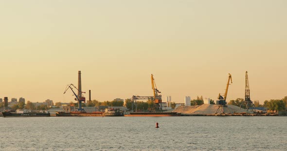 Cargo shipping. Cargo crane terminal, River ship port, Barge with cargo on the river