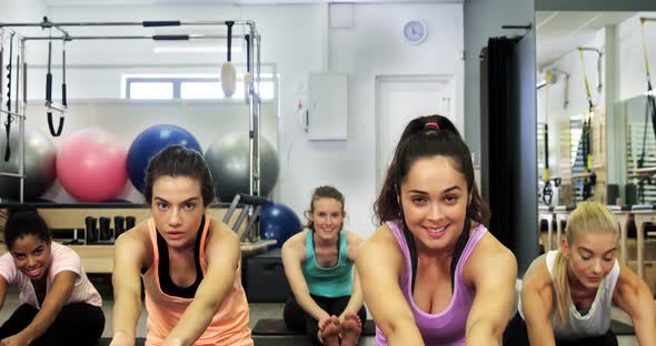 Beautiful women exercising in fitness studio