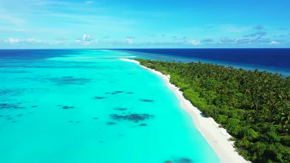 Daytime fly over abstract shot of a sandy white paradise beach and blue water background in hi res 4