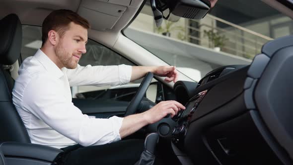 The Man is Pleasantly Surprised By the Functions of the New Car