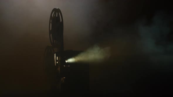 Shows Movie in a Projector in the Smoke. Black Background alt