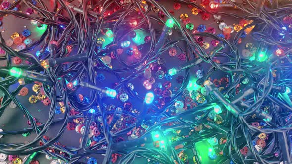 Background of colorful garlands and light bulbs for christmas holiday new year