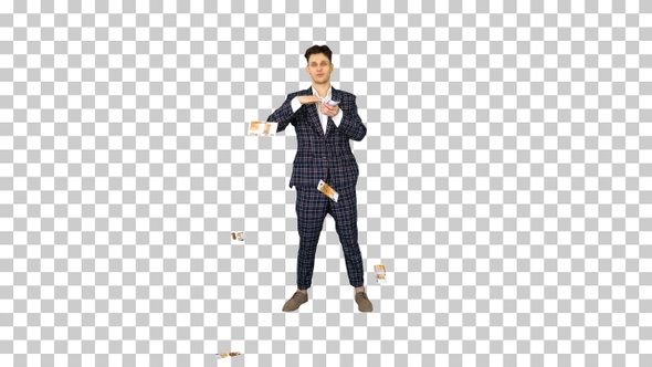 Young happy businessman dancing and throwing money, Alpha Channel