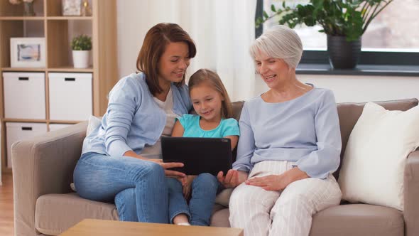 Mother, Daughter and Grandmother with Tablet Pc 