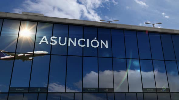 Airplane landing at Asuncion Paraguay, Asunción airport mirrored in terminal