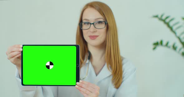 Female Doctor in Glasses Demonstrating Digital Tablet with Chroma Key in Hospital, Portrait of Woman