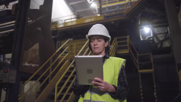 Caucasian Female Engineer Posing at Rockwool Manufacturing Plant