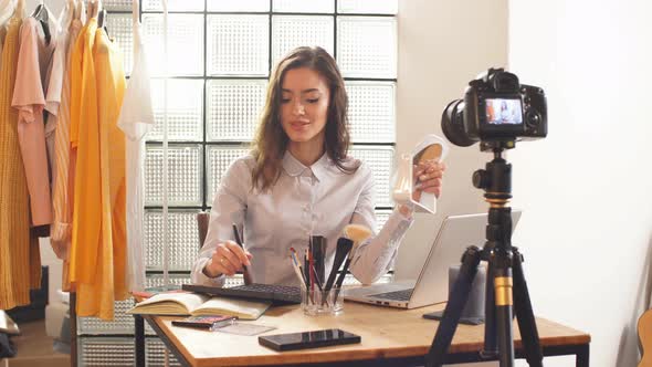 Blogger Shoots a Video on a Professional Camera for Her YouTube Channel. Remote Work During the