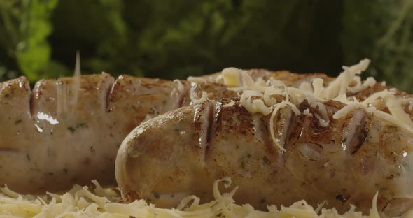 Grilled Sausages With Cheese Were Laid Out On A Plate. Serving A Meat Dish