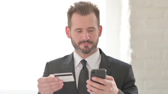 Young Businessman Shopping Online on Smartphone Banking