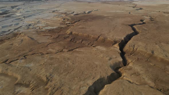 Desert brown stone huge crack in the ground, drone shot