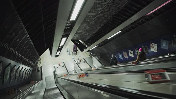 Quiet escalator in London Underground tube train station in Covid-19 Coronavirus pandemic lockdown i