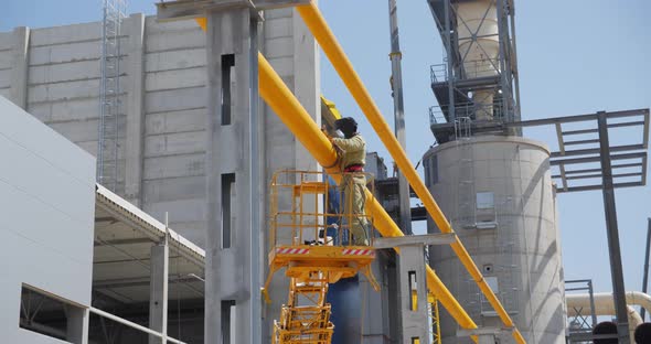 Gasman Welds Pipes At The Factory