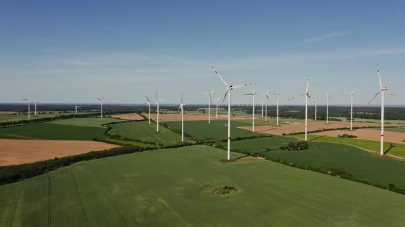 A Drone Shot of a Massive Wind Farm in Agricultural Land