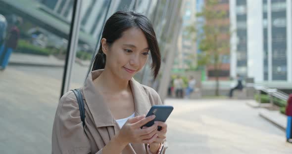 Woman Use of Mobile Phone in City