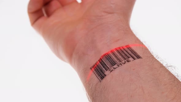 the Scanner Scans the Wrist of a Person with a Barcode Labeled Slave