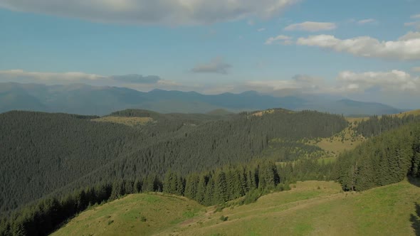 Panoramic View of Majestic Mountains and Cloudy Sky