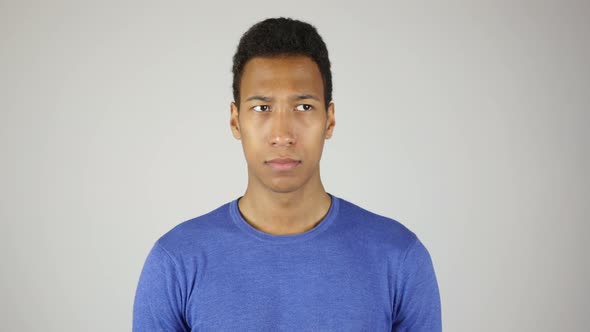 African Man Looking Around White Background