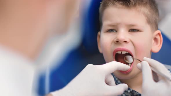 Close Up Face Attractive Boy with Healthy Teeth at Regular Checkup of Dentist