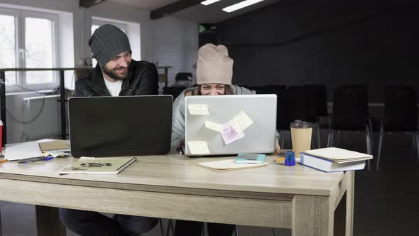 Young Man and Woman Working in Creative Office