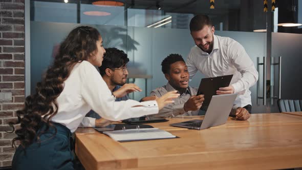 Diverse Young Employees Sitting in Office Happy Business People Rejoice Celebrate Victory Successful